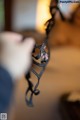 A close up of a person holding a pair of glasses.