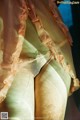 A close up of a woman's butt in a sheer dress.